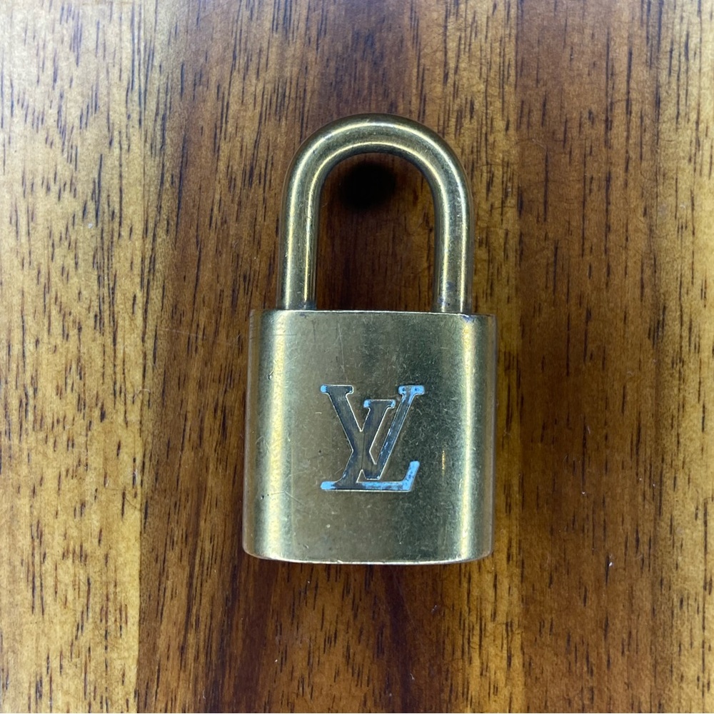 Louis Vuitton Gold Lock 317